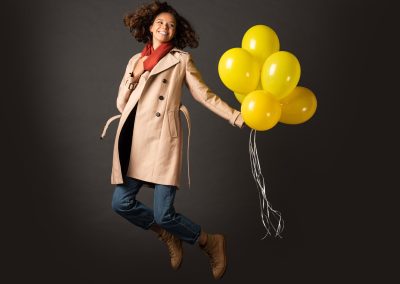 happy-curly-woman-in-trench-coat-jumping-with-yell-2026-01-06-00-45-09-utc